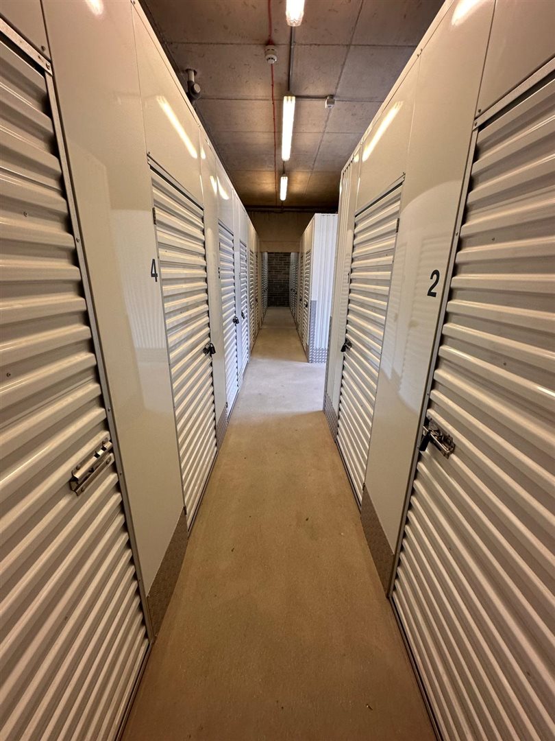 Wide, well-lit corridors for easy access to storage units